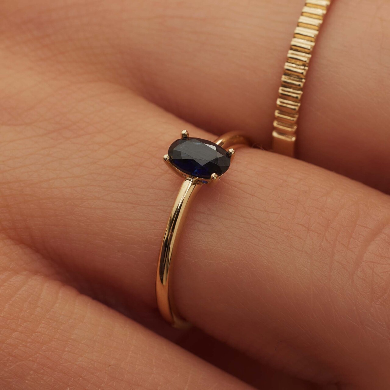 Isabel Bernard Baguette Nila 14 karat gold ring with blue zirconia stone