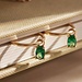 Isabel Bernard Baguette Olivia 14 karat gold hoop earrings with green zirconia stone