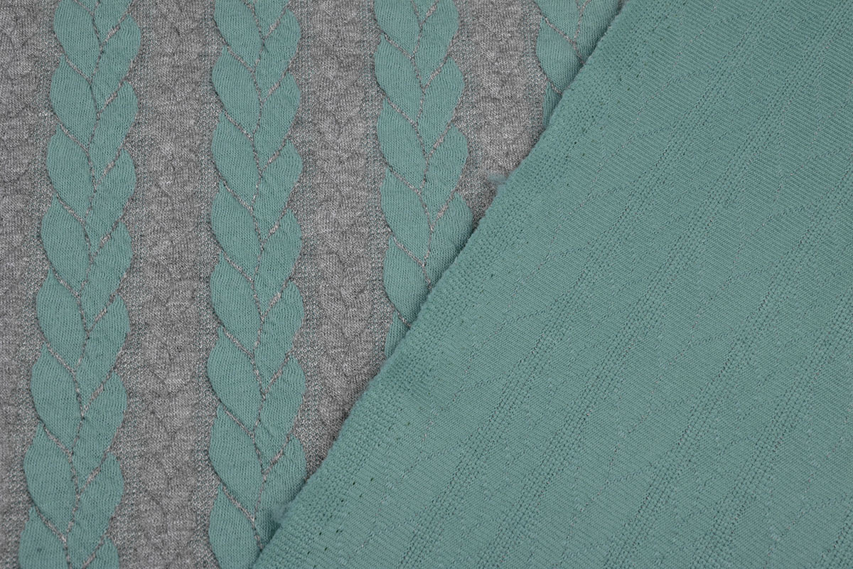 Strickstoff Zopfmuster Jersey Minzgrün Grau