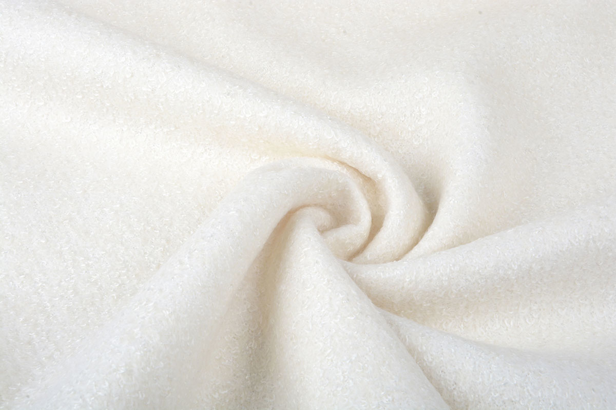 Gestrickter Wollstoff Lanoso Creme