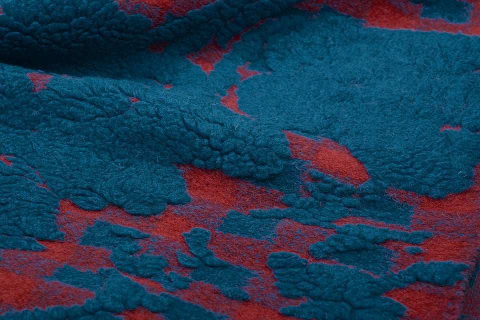 Gestrickter Wollstoff Schafswolloptik Karo Petrol Rot
