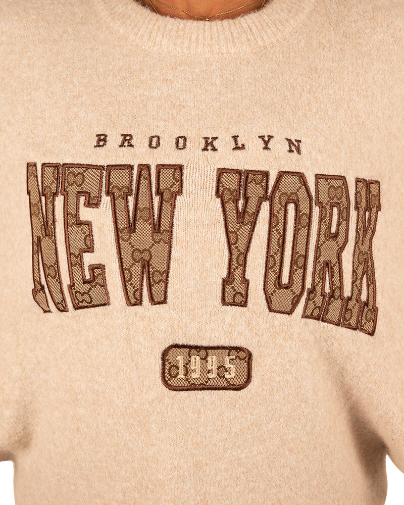 Beige trui "New York" van Moocci