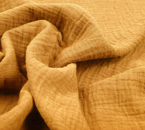 Oeko-Tex® Tessuto di Mussola Giallo Ocra Oeko-Tex® Tessuto di Mussola Giallo Ocra
