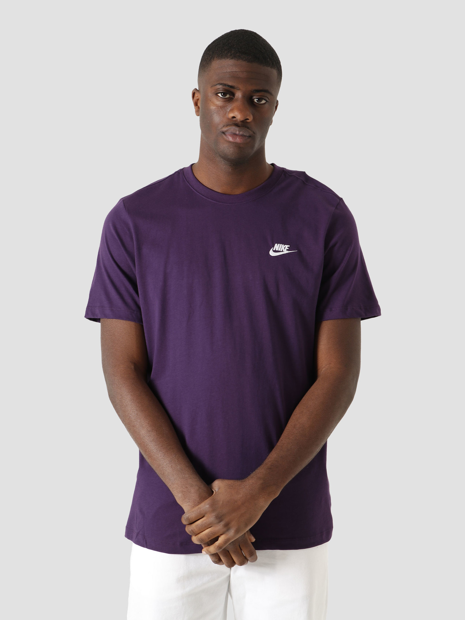 purple white nike shirt