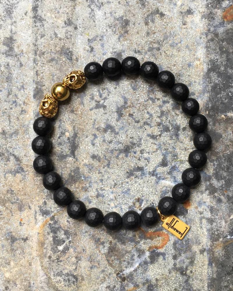 Black Onyx - faceted - golden Skulls - 8 mm