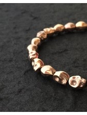 Skulls-in-line |  rosé-gold-plated  | 6x8 mm