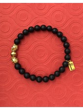 Black Onyx - matt - faceted - golden Skulls - 8 mm