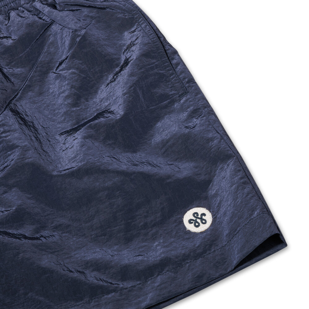 WOEI PATCH SHINY NYLON SWIM SHORT ‘NAVY BLAZE