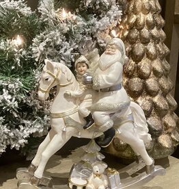Père Noël sur cheval à bascule