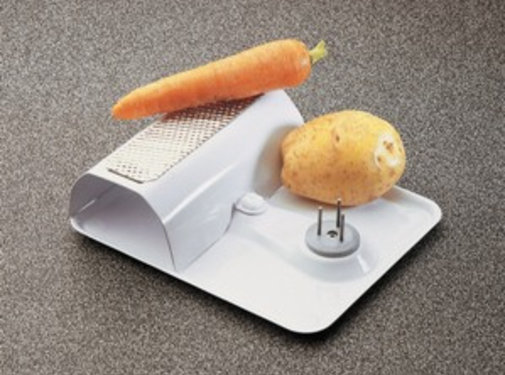 Groentenschraper op voet met fixatienagels