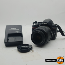 Nikon D3100 + Nikon 18-55mm Lens + Tasje en Oplader