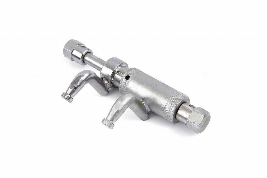 Exhaust spring tensioner