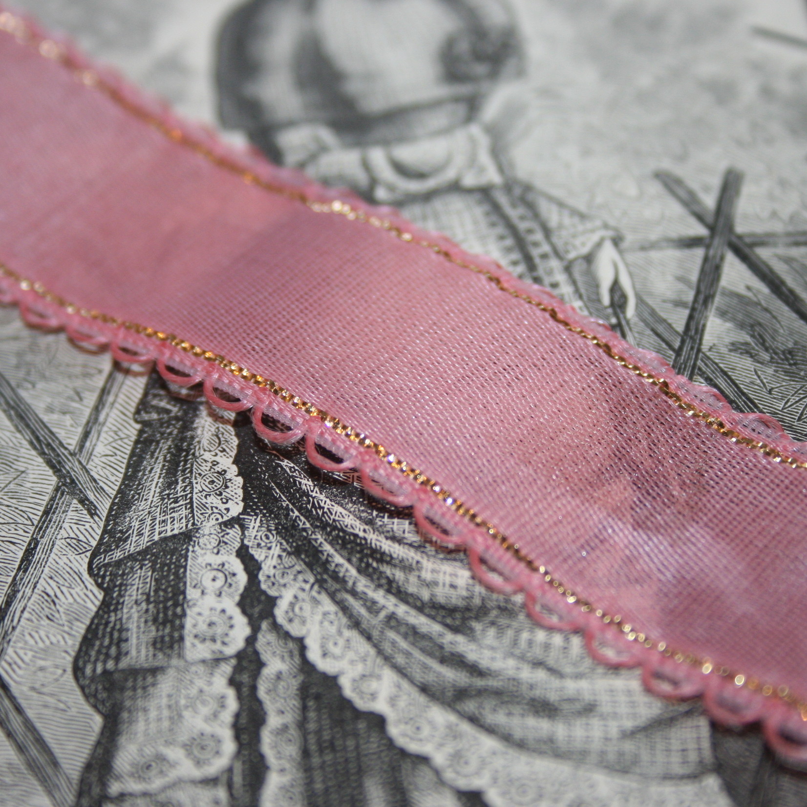 Vintage pink gauze ribbon with gold edge.