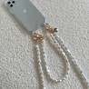 xoxo Wildhearts iPhone 13 mini transparant hoesje met kort Pearlfection koord xoxo Wildhearts iPhone 13 mini transparant hoesje met kort Pearlfection koord
