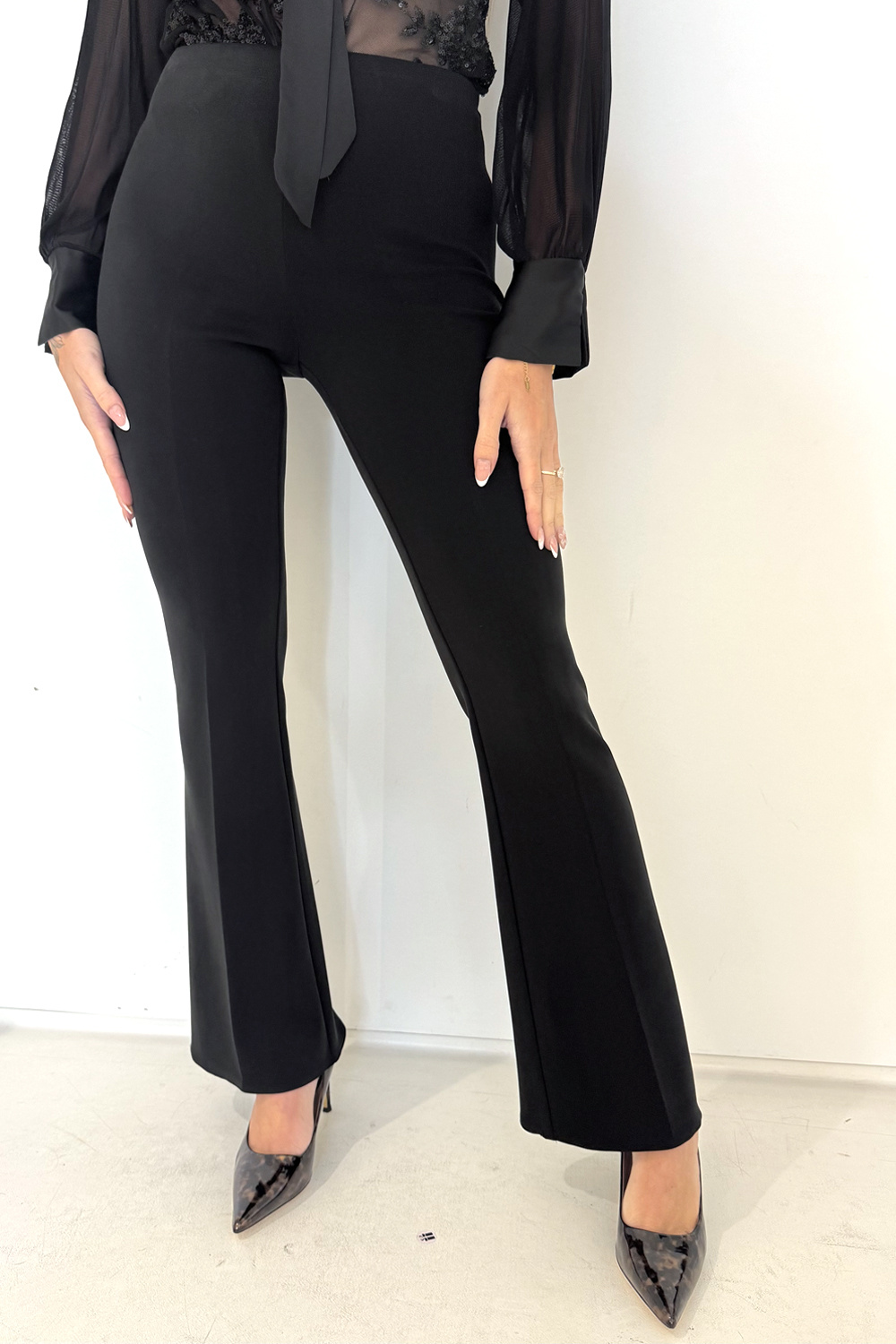 RINASCIMENTO Rinascimento Flared pantalon in jogging stof ZWART