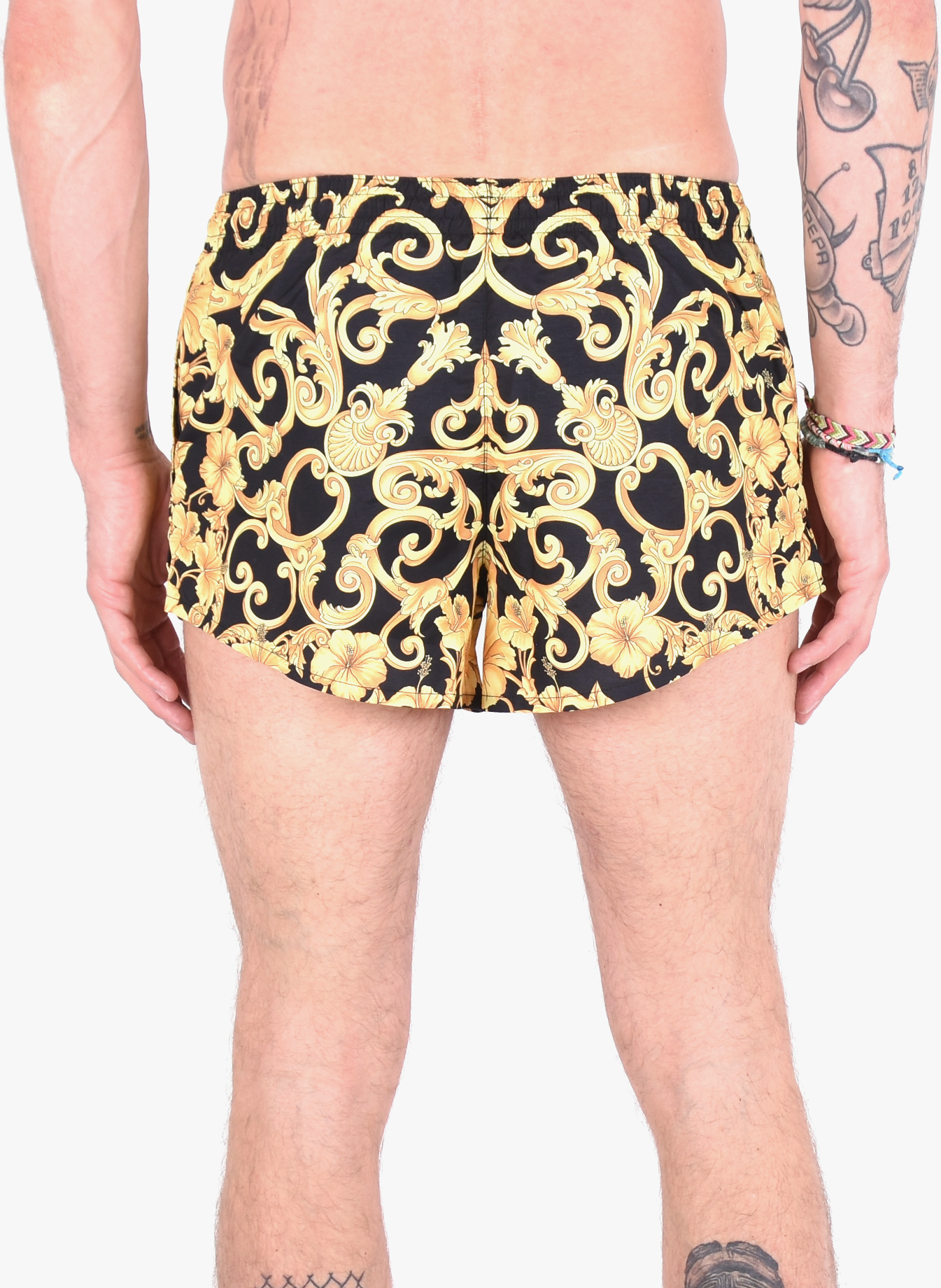 black and gold versace swim shorts