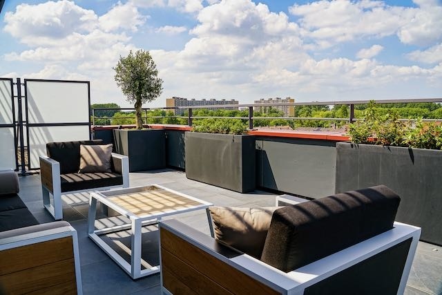 Heb je een kleine tuin? Kijk eens naar verticale begroeiing!