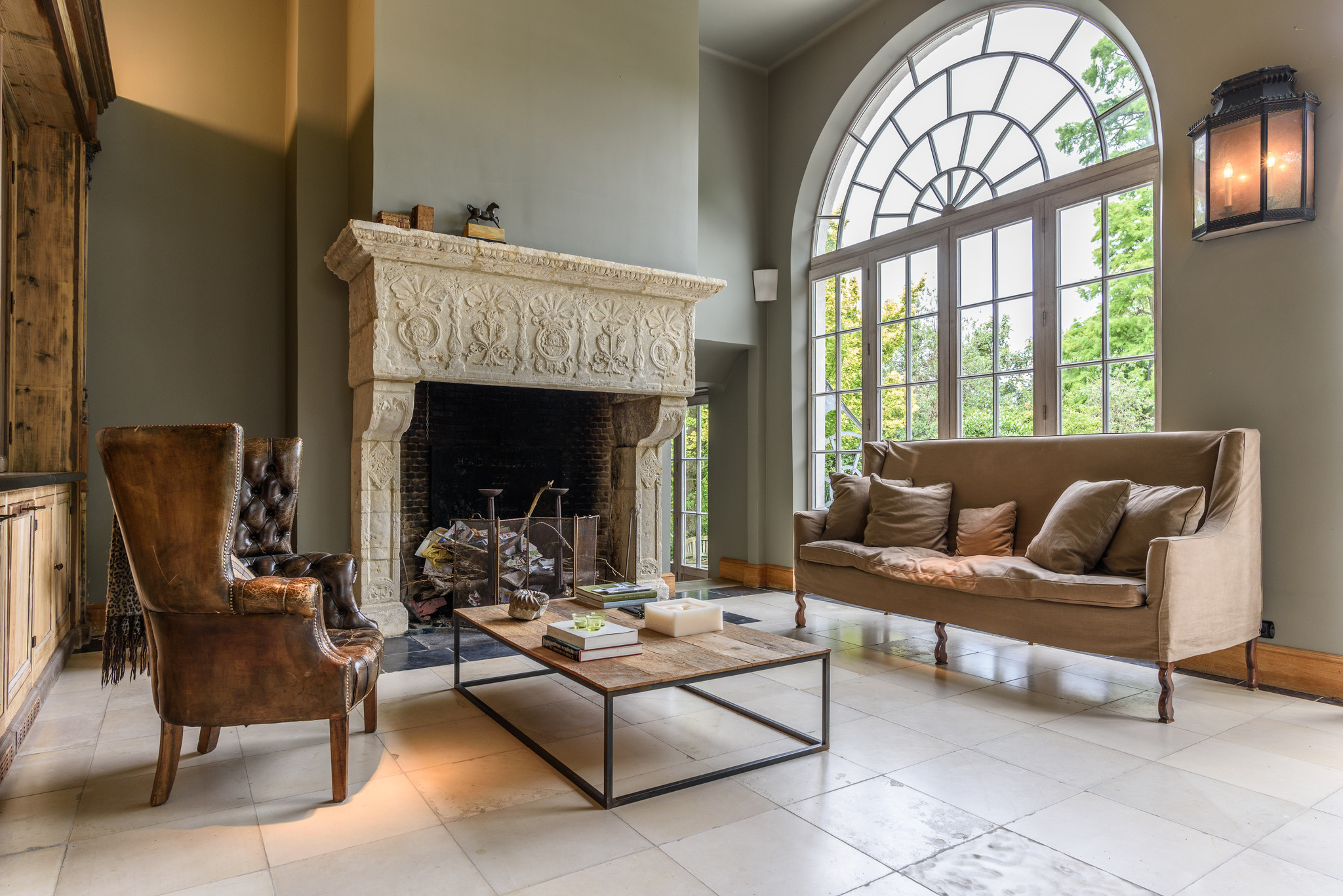 One Large Historic Fireplace Mantel in Limestone In Timeless Veranda Kitchen 