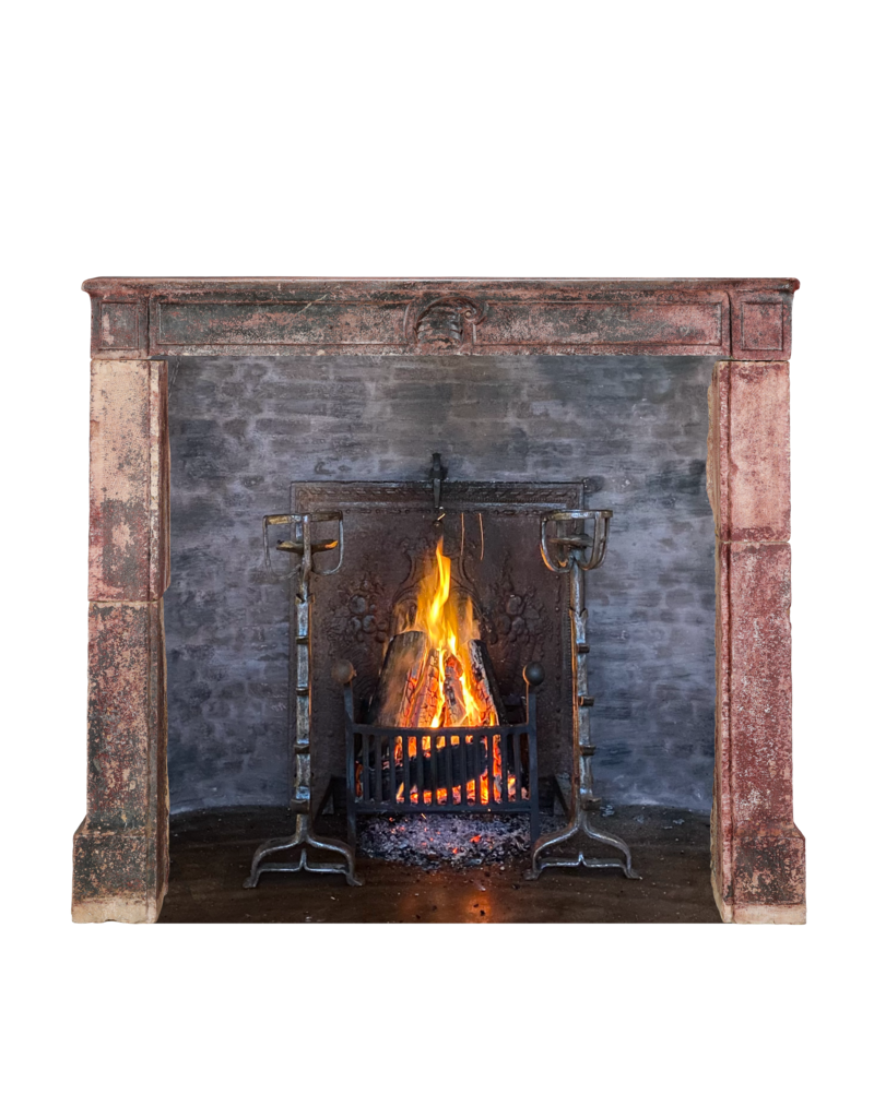 Maison Leon Van den Bogaert 16th Century French Limestone Fireplace Mantel With Original Paint Layers and Sculpted Jester’s Cap – “Dans son Jus” Castle Mantel