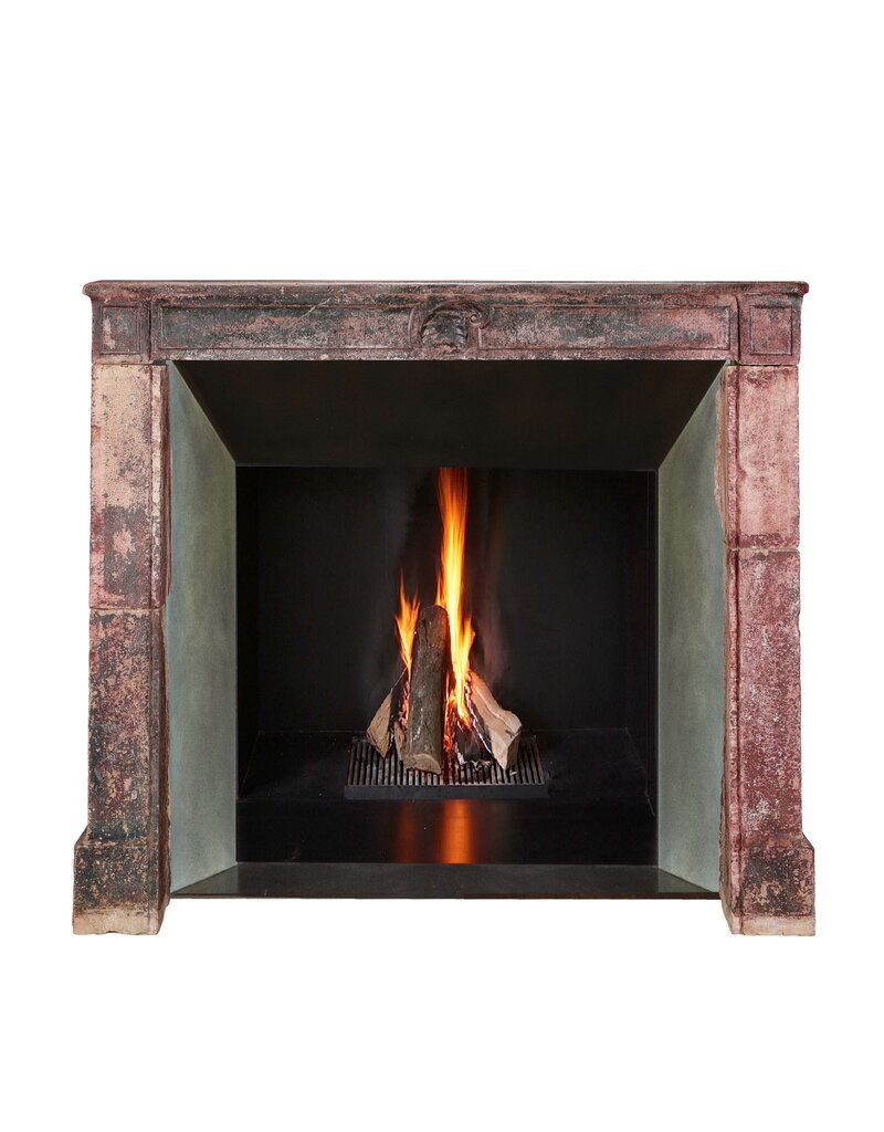 Maison Leon Van den Bogaert 16th Century French Limestone Fireplace Mantel With Original Paint Layers and Sculpted Jester’s Cap – “Dans son Jus” Castle Mantel