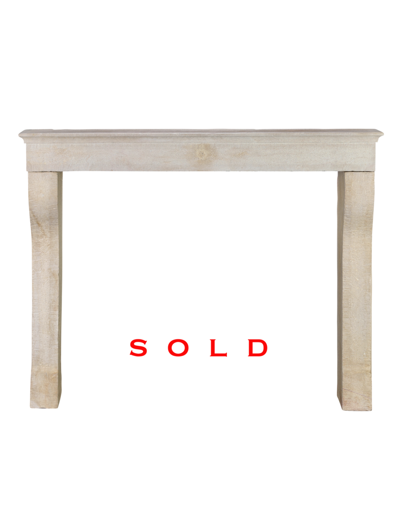 Maison Leon Van den Bogaert Elegant 19th Century Hand-Carved French Fireplace Mantel in Pale Limestone with Soft Curved Jambs