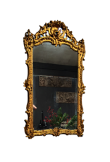 Maison Leon Van den Bogaert Antieke Franse Régence spiegel in verguld hout met origineel spiegelglas, rocaille snijwerk en warme gouden patina