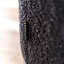 Bouclé poef Nora zwart