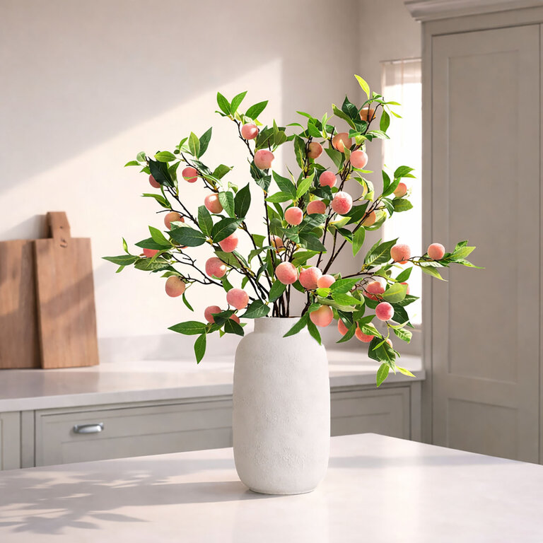Kunsttak Perzik met geelroze fruit en groene bladeren is een kunststeel met een natuurgetrouwe uitstraling en een lengte van 85 cm.
