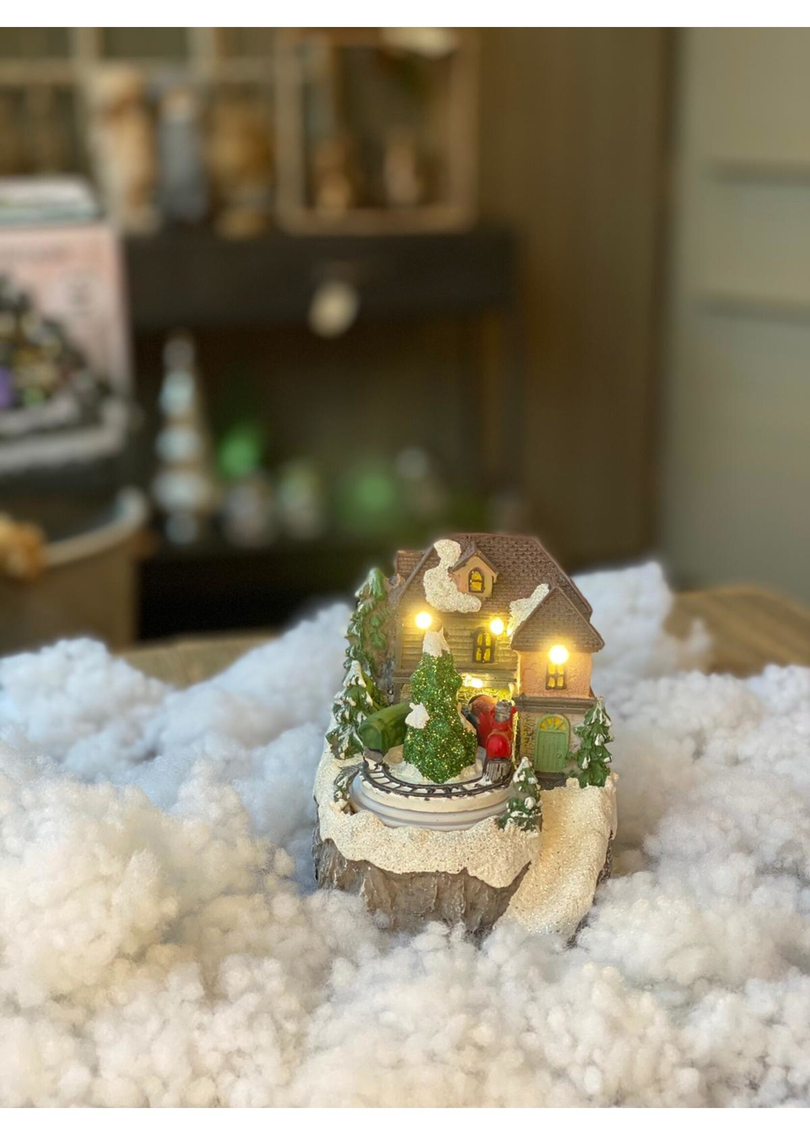 Huis voor kerstdorp met trein