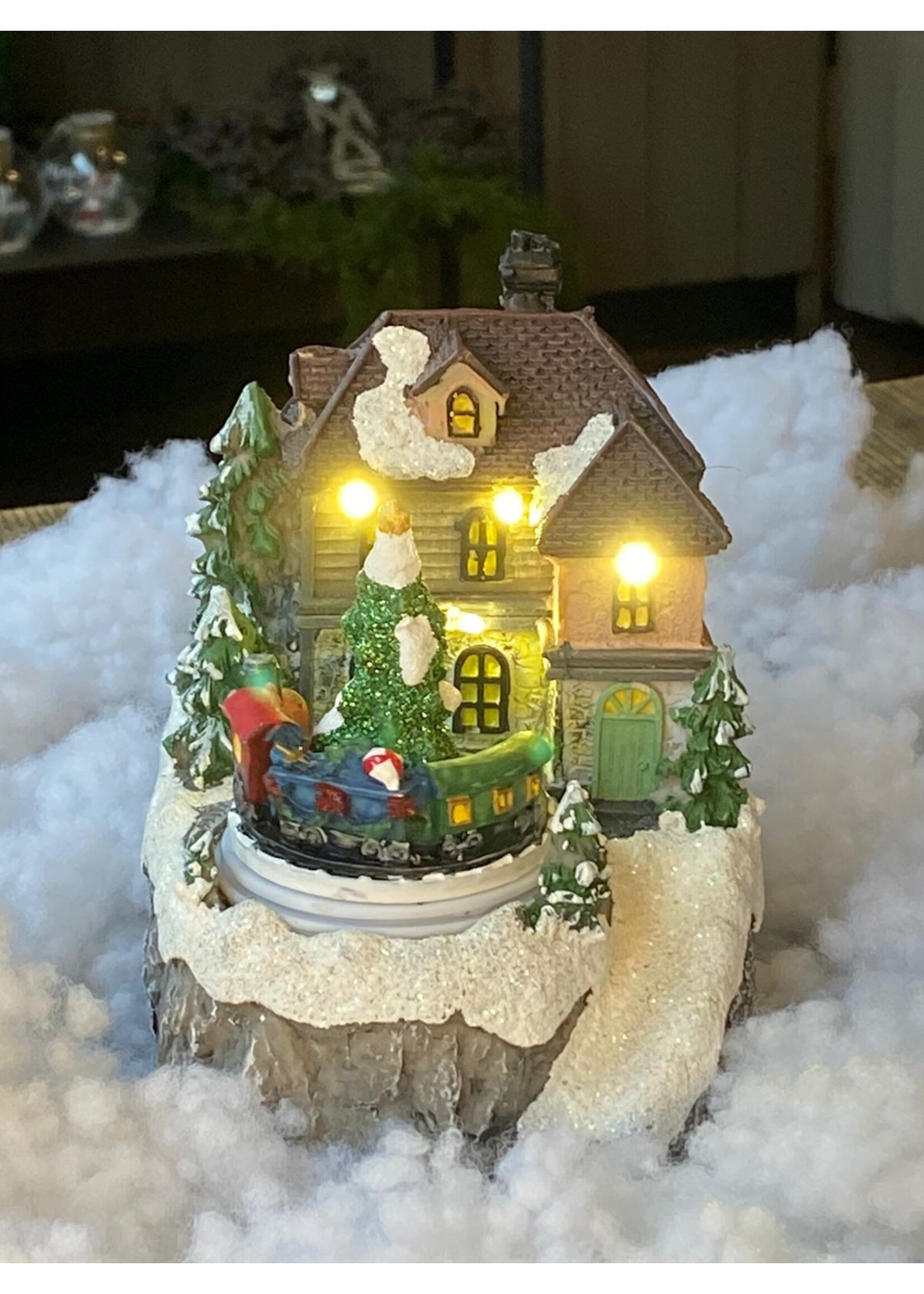 Huis voor kerstdorp met trein