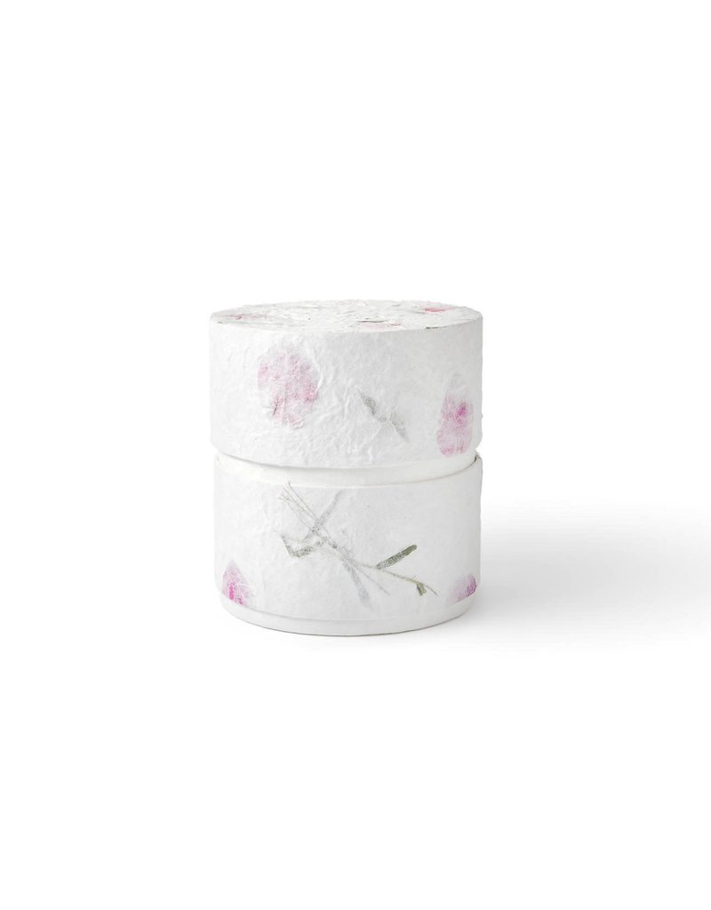 . Eco urn covered with natural paper with flowers