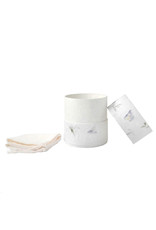 . Eco urn covered with natural paper with flowers