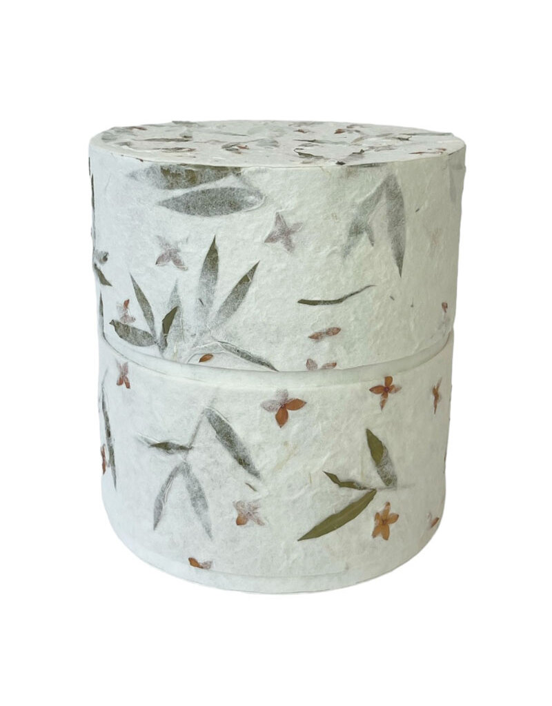 . Eco urn covered with natural paper with flowers