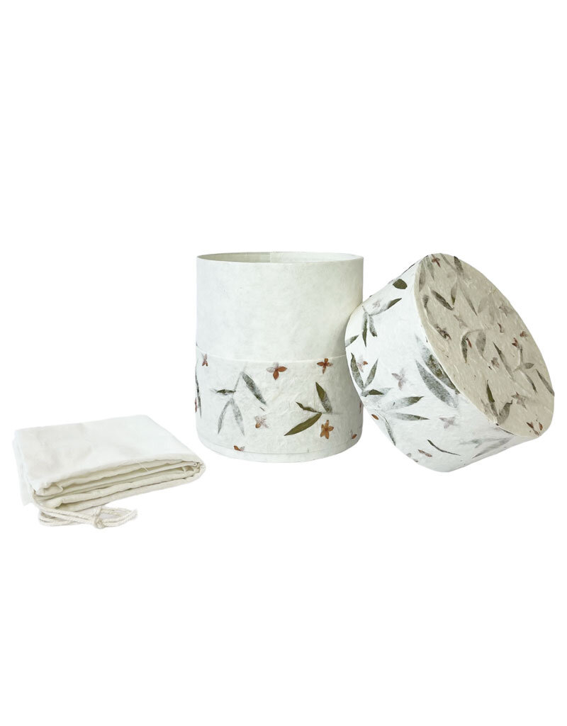 . Eco urn covered with natural paper with flowers