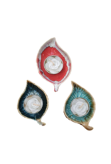 plat en porcelaine avec bougie chauffe-plat