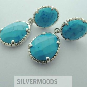 P23 OZ0146 OORSTEKER Ag925 HOWLIET TURKOOIS 34MM 2XOVAAL