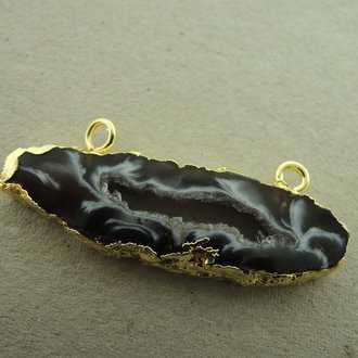 9745 AGAAT ZWART/WIT/GRIJS +-35MM ONREGELMATIG GOUDKLEURIGE RAND 2 OGEN