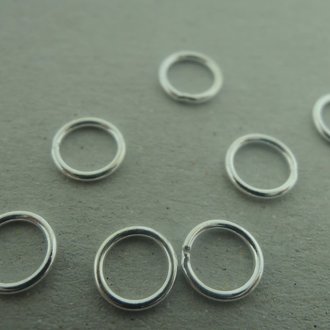 ENLC60-08 GESLOTEN OGEN(50 stuks) Ag925 6MM DIAMETER 0.8MM DRAADDIKTE ROND