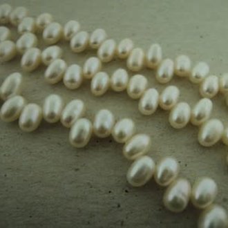 P4015 ZOETWATERPAREL WIT+-4MM RIJST TOP GEBOORD