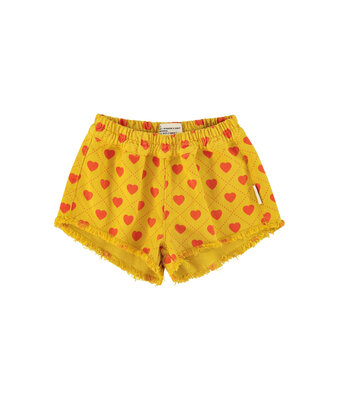 shorts w fringes // mustard w red hearts