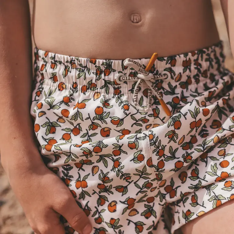 Salted Stories pommegranate swim shorts // white swan