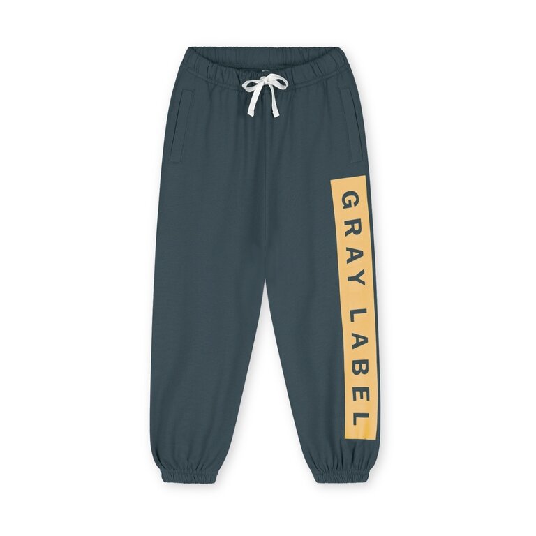 Gray Label logo track pants // blue gray / bright cookie
