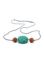 Necklace with turquoise color stone pendant and rudraksha beads