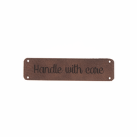 Leren label 'Handle with care' 15x60mm - 2 stuks Marlaine Leren label 'Handle with care' 15x60mm - 2 stuks
