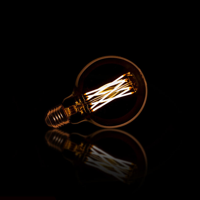 WoonStijl Lichtbron LED filament bol Ø9 5 - E27 6W dimbaar / Amberkleurig glas