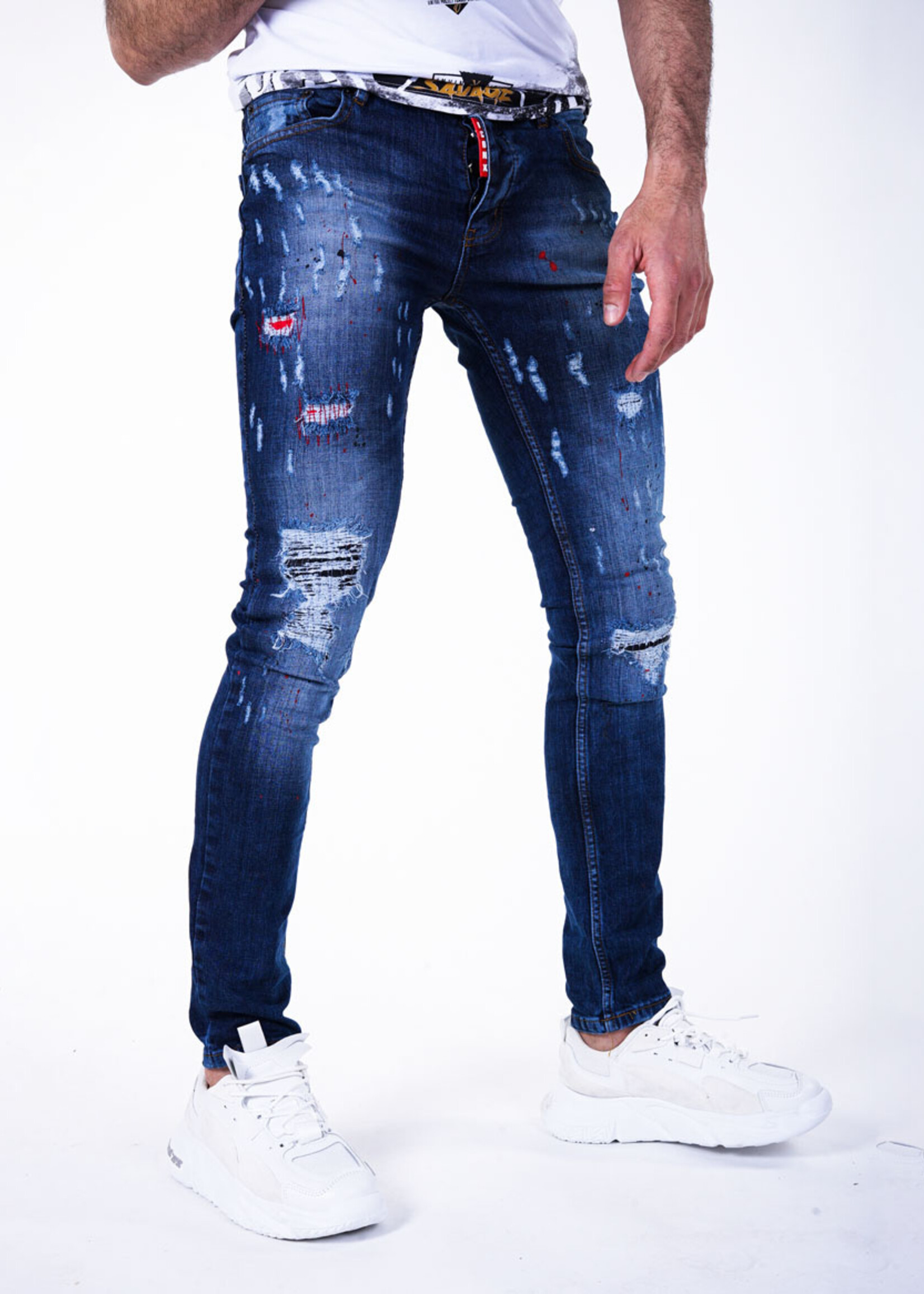 Stoere blauwe jeans met scheuren
