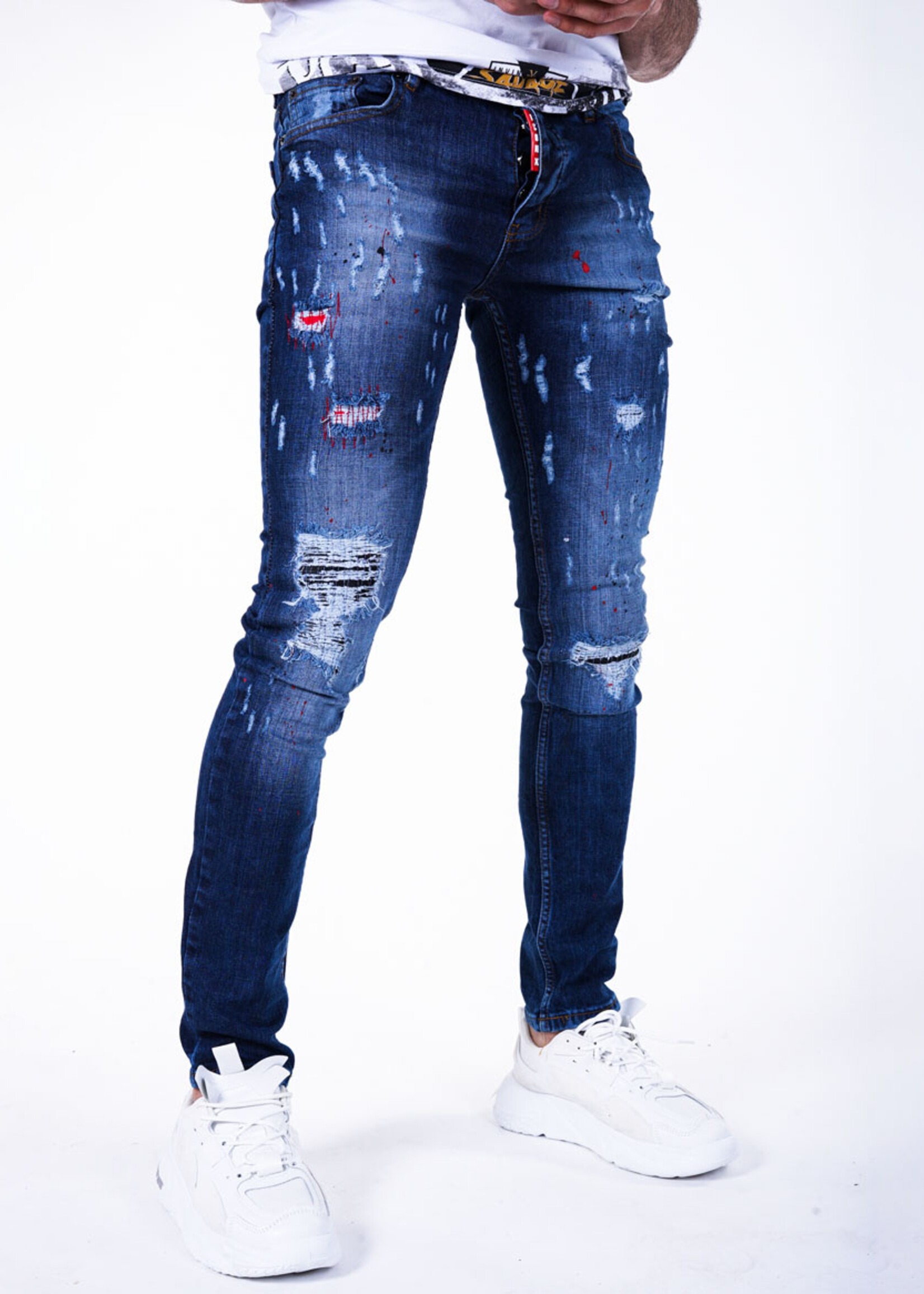 Stoere blauwe jeans met scheuren