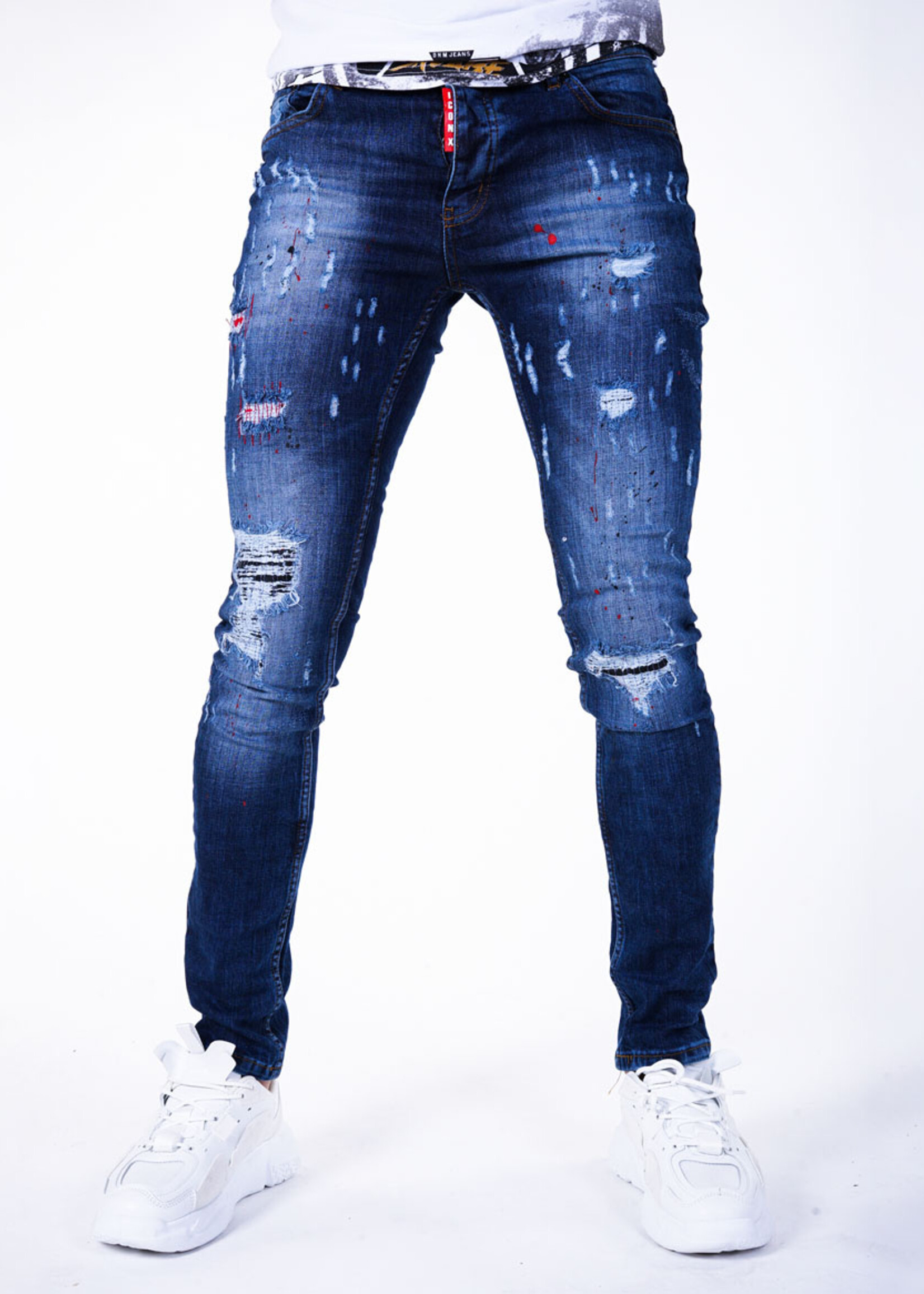 Stoere blauwe jeans met scheuren