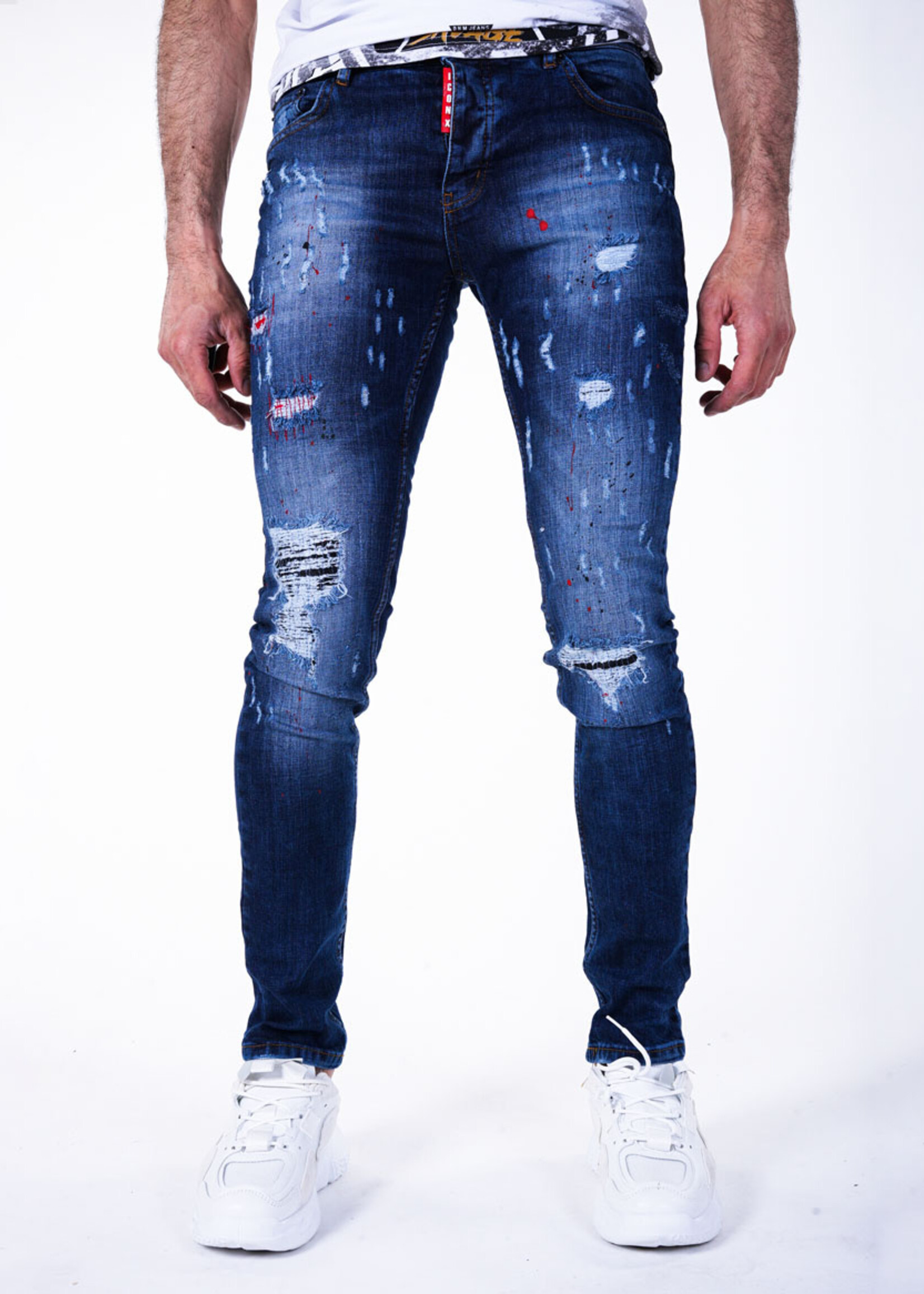 Stoere blauwe jeans met scheuren