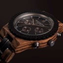 Prepare for adventure with our fully featured, hand-crafted Chronograph wrist watch. This premium design watch features a 45mm zebra case, black stainless steel dial and a SEIKO VD54 movement. The unique new strap combines sustainable ebony and zebra wood